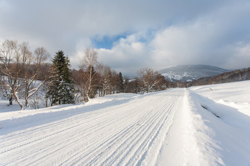 Snowy road in Bieszczady, Bieszczady Mountains, Bieszczady National Park, Carpathians Mountains, Poland © Maciej