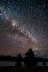 Beautiful milky way, starry night over the snow mountain at Lake Pukaki, New Zealand. High ISO Photography.