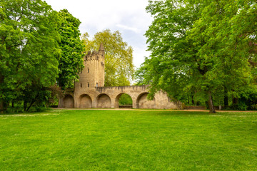 Fototapeta na wymiar Park behind Speyer Cathedral with old city fortification and tower, Speyer, Germany