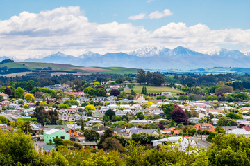 Beautiful landscape of the town with blue sky and snow mountain. Omaru, New Zealand.