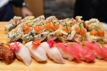 Various sushi rolls on plate, closeup of sushi platter