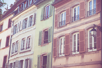 Row of colorful buildings with windows and shutters in Strasbourg France