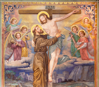 PRAGUE, CZECH REPUBLIC - OCTOBER 12, 2018: The symbolic idilic painting of St. Francis of Assisi and crucificted Jesus in church Bazilika svatého Petra a Pavla na Vyšehrade.