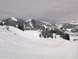 Ski slopes and snow-capped mountains in Hoch-Ybrig, Switzerland.