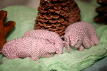 a group of knitted pigs
