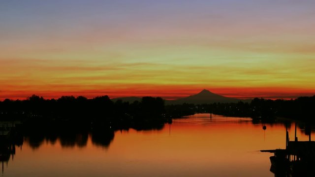 UHD 4K time lapse video of Sunrise with Mt.Hood along Willamette river from dark to orange sky with water reflection in Oregon 3840x2160 Ultra High Definition 