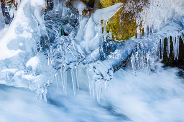 Beautiful mountain river in winter  with icicles