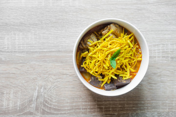 Khao soi - Traditional Thai Food, Khao Soi Thai Noodle Curry Soup with chicken on wood table, Khao soi a famous northern Thai food