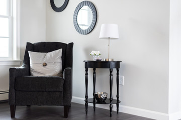 Living room chair, black with black reading table and lamp