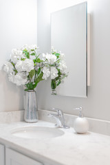 White Bathroom with white flowers