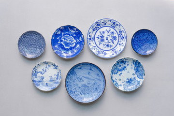 Set of ceramic dishes on table background. Top view