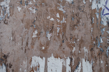 distressed aged wall pealing paint weathered with scrapes, nicks, scratches and marks