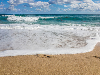 Ocean surf on the sandy beach