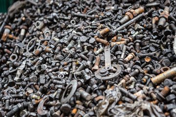 Pile of many bolts and screws