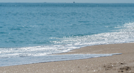 Fototapeta na wymiar Ocean surf on the sandy beach