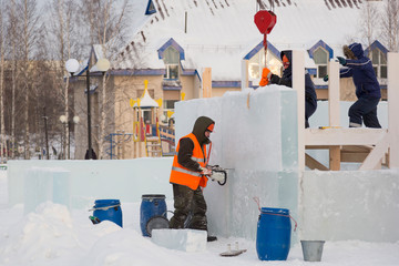 Installers at the construction of the ice town