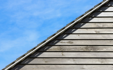 Old Wood Planks Texture Under The Roof And Natural Sky Background