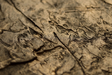 Blurred abstract background texture of the old surface color of copper. Cropped shot, close-up, horizontal, blurred