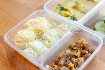 Chicken Curry Soup with Rice Vermicelli, Fried Eggs with Preserved Turnip and Cucumber in box meal.