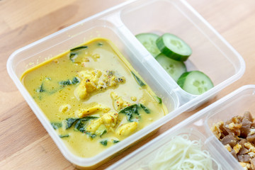 Chicken Curry Soup with Rice Vermicelli, Fried Eggs with Preserved Turnip and Cucumber in box meal.