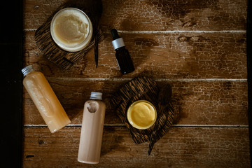 Natural SPA cosmetics on wooden table overhead