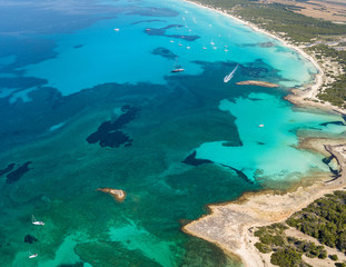 Amazing drone aerial landscape of the charming beach Es Trencs. It has earned the reputation of...