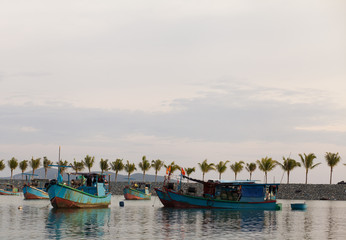 Naklejka na ściany i meble Fishing boat on the sea in Vietnam