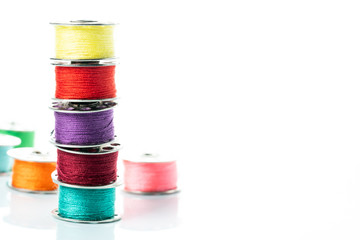 colored yarns on spools