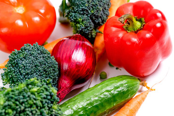 a fresh group of vegetables on white background