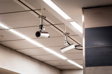 CCTV cameras on a roof at a subway station.