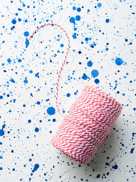 Red Twine String Roll On White Background