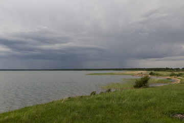 landscape with lake and stormy clouds