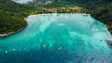 hi season boat and tourists on phiphi island Krabi Thailand aerial view from drone
