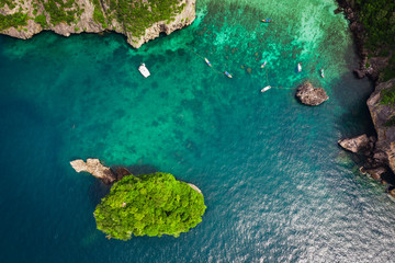 hi season boat and tourists on phiphi island Krabi Thailand aerial view from drone