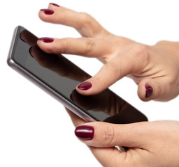 Phone in hand of a girl on a white background