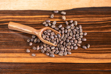 coffee beans in wooden spoon