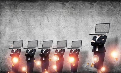 Business women with laptops instead of head.