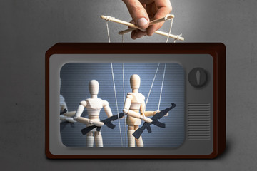 Fake News on TV. Concept of war. People with weapons, armed protest, terrorists. The puppeteer...