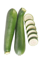 Two zucchini and zucchini rings top view on white background
