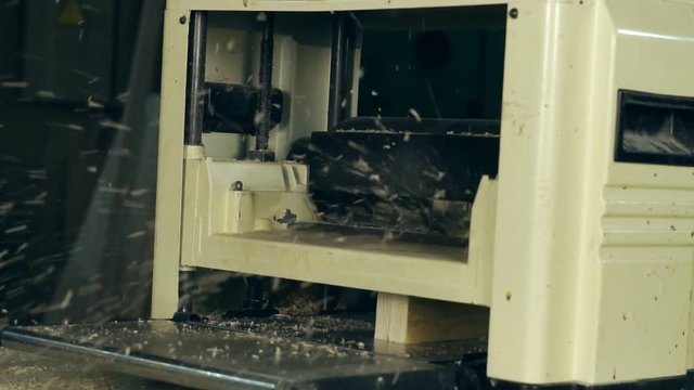 the wood on the jointer machine