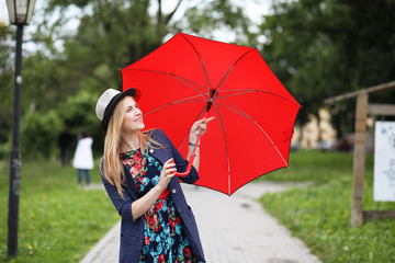 Girl in the street with an umbrella