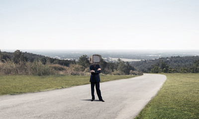Businessman with old TV instead of head.