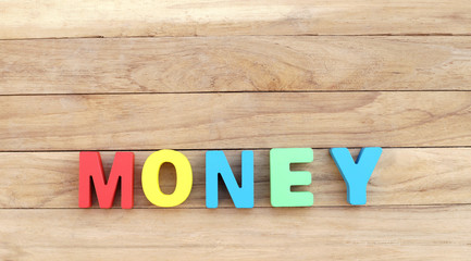 Colorful Word ' MONEY ' on Lower Wooden Board 