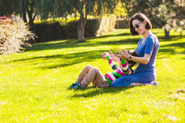 A woman spends time with her son in nature.