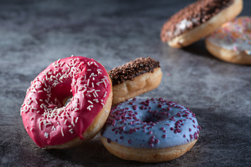 Donuts with New Year Ornaments. presented on black marble