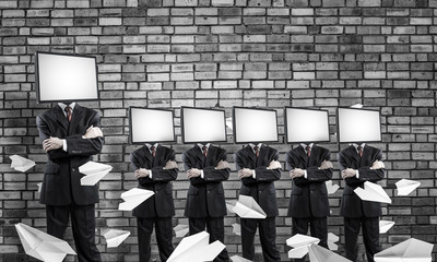 Businessmen with TV instead of head.