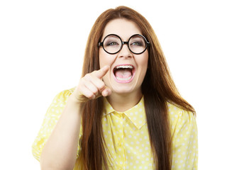 Happy young woman in eyeglasses pointing