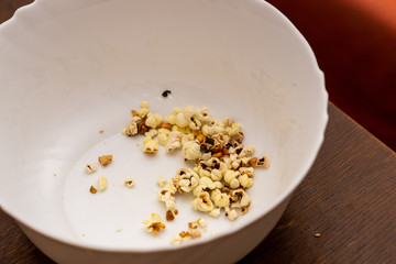 empty ceramic bowl of popcorn