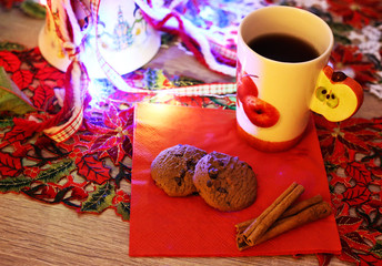 night home scene - Christmas cookies with hot coffee on a festive decorated table