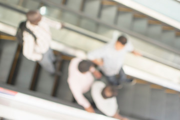 Top view of blurred people and escalator background